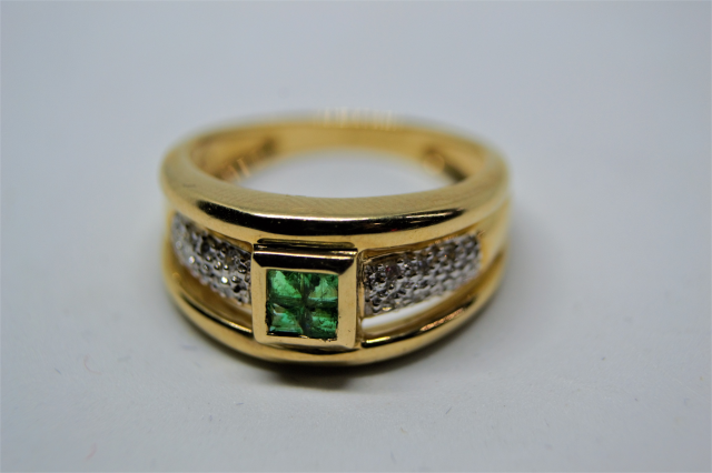 A 9ct Gold Emerald and Diamond Ring. 