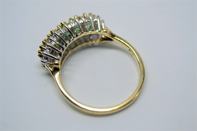 A 9ct Gold Five Emerald and Diamond Ring.