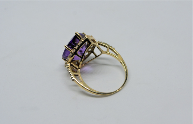 A 9ct Gold With Large Pear Cut Amethyst And CZ Ring.