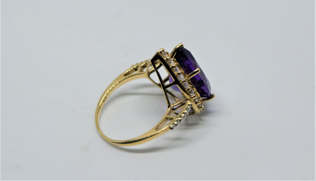 A 9ct Gold With Large Pear Cut Amethyst And CZ Ring.