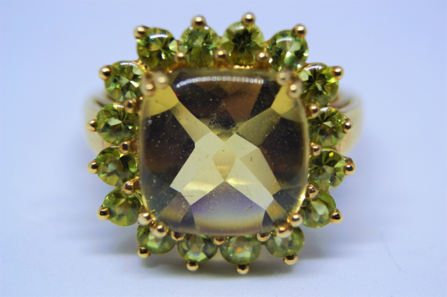 A 9ct Gold With Peridot Cluster Ring.