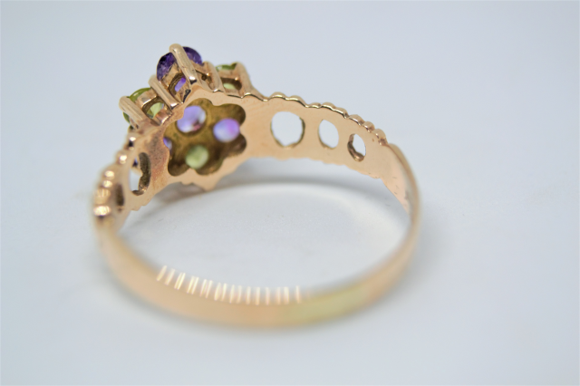 A 9ct Gold With Amethyst And Peridot Cluster Ring.