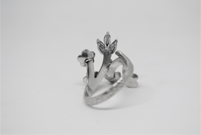 A White Metal With Sapphire And Diamond Abstract Ring.