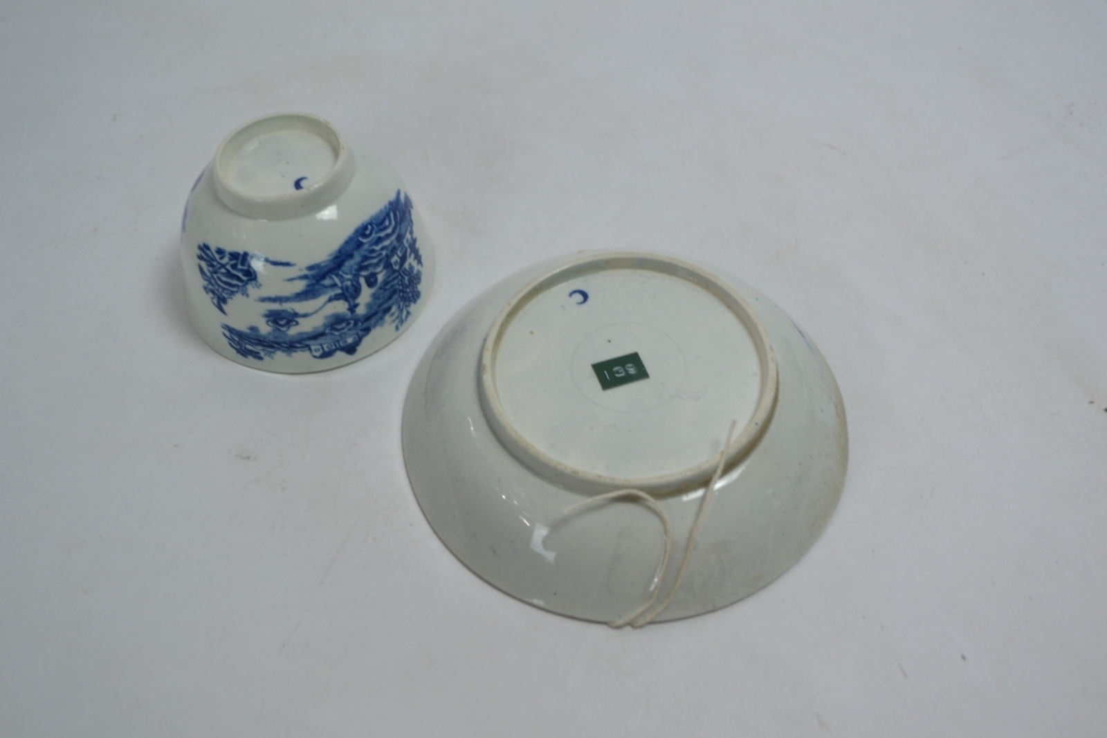 A Late 18th Century Worcester Teabowl and Saucer Decorated in the Underglaze Blue and White Fisherman and Cormorant Pattern