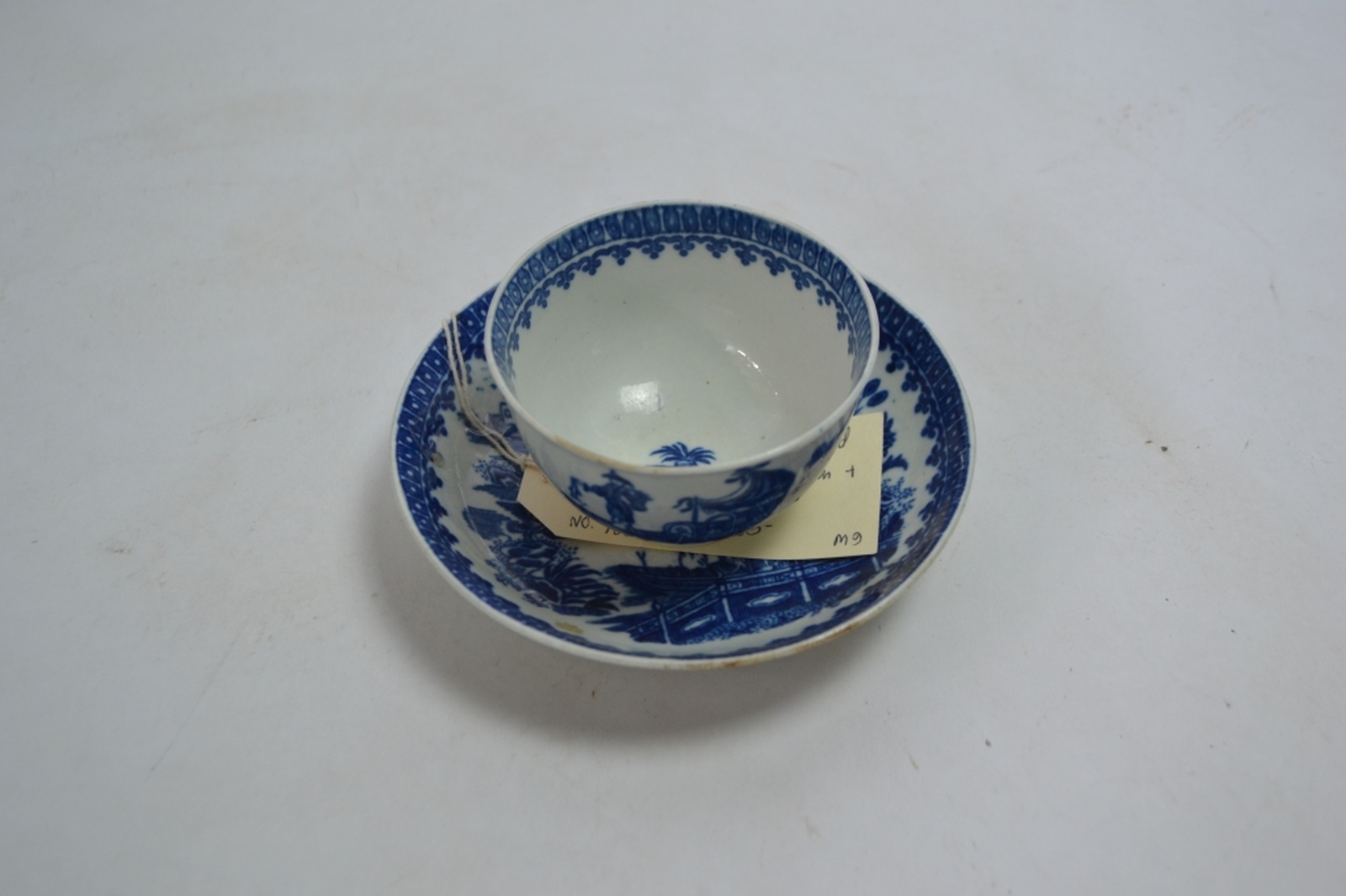 A Late 18th Century Worcester Teabowl and Saucer Decorated in the Underglaze Blue and White Fisherman and Cormorant Pattern