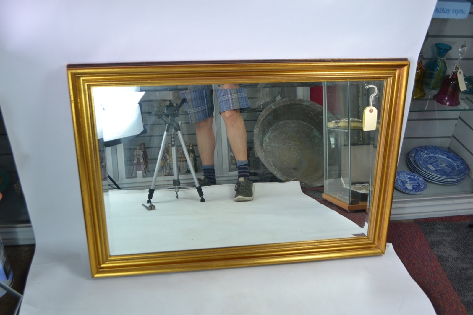 Gilt framed bevelled edge mirror.