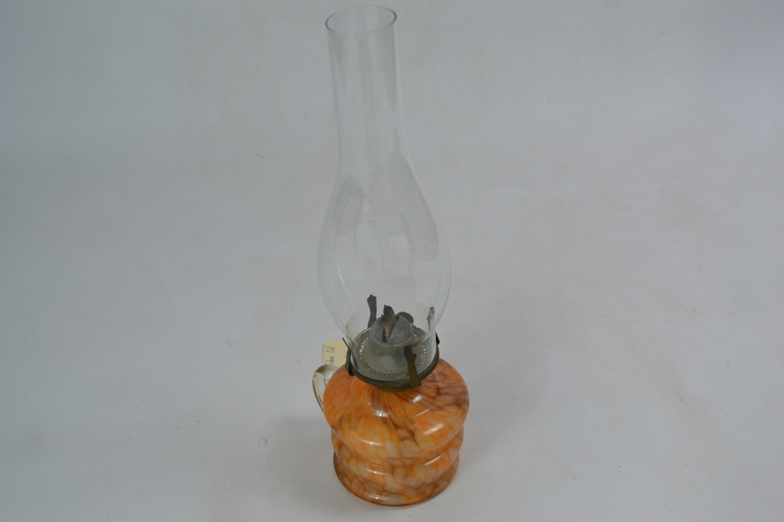 Early 20th century glass oil lamp with mottled orange reservoir