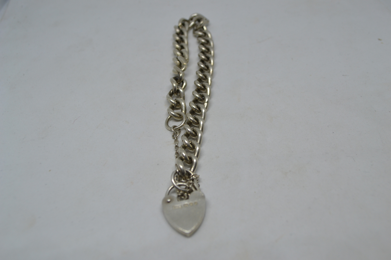 Solid Sterling Silver Curb Link Bracelet With Heart Padlock And Safety Chain.