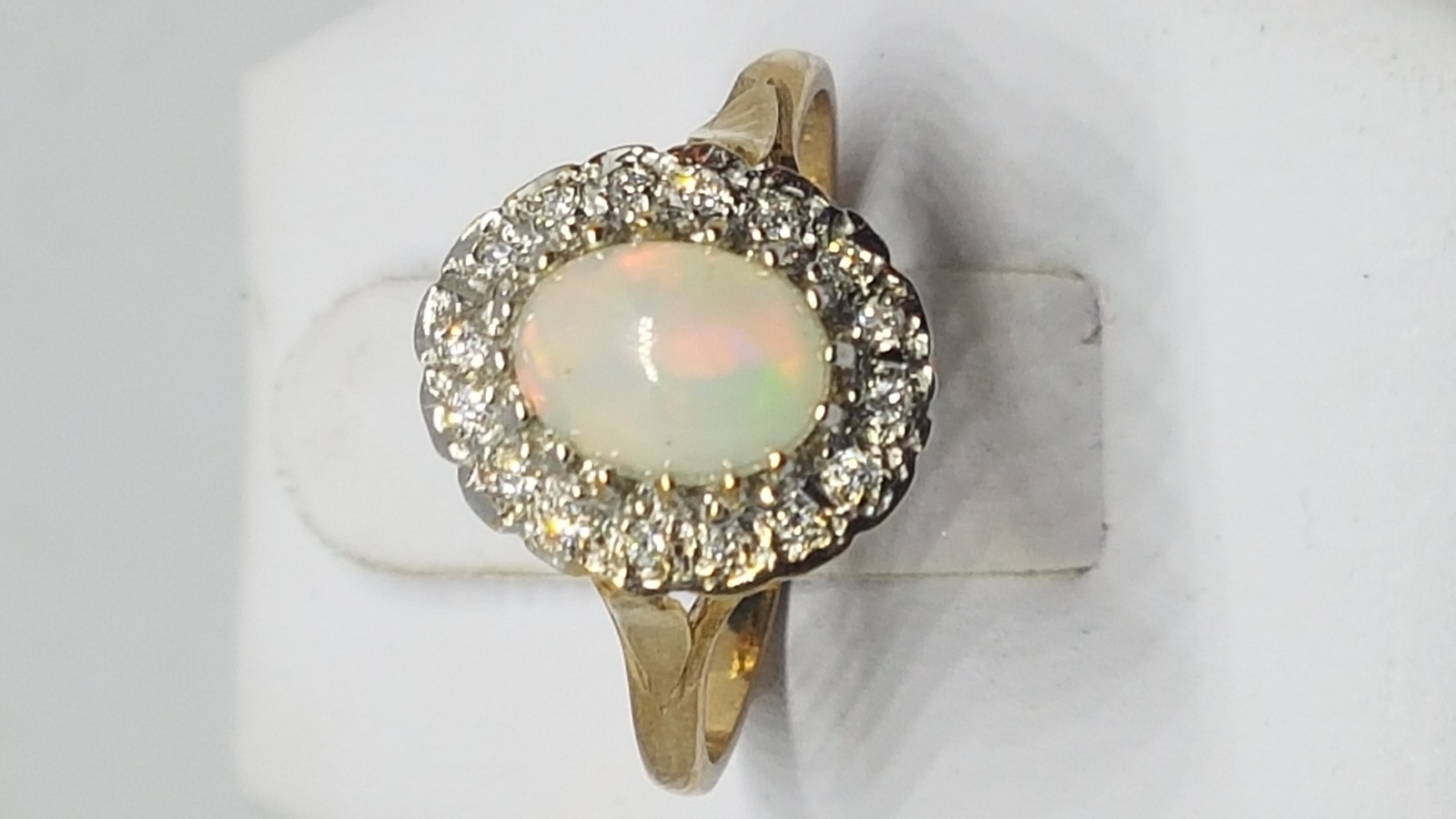 A 9 ct Gold Opal And Diamond Cluster Ring