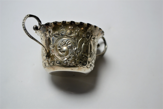 A Silver Two Handled Loving Cup With Repousse Decoration.