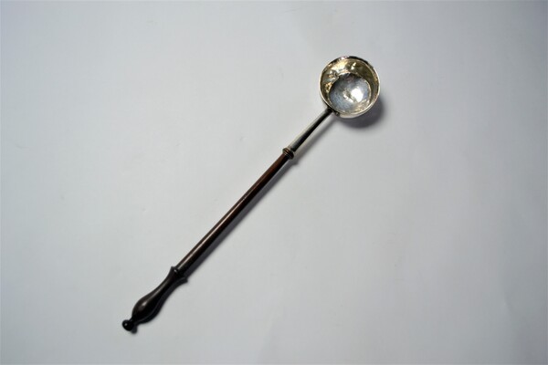 An 18th c. Silver Toddy Ladle With Wooden Handle.