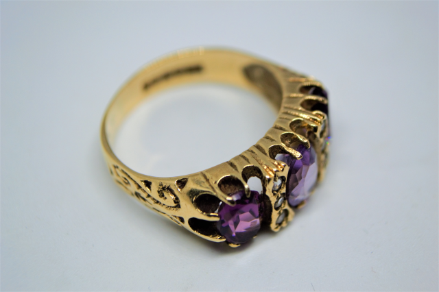 A 9ct Gold Ring with 3 Stone Amethyst.