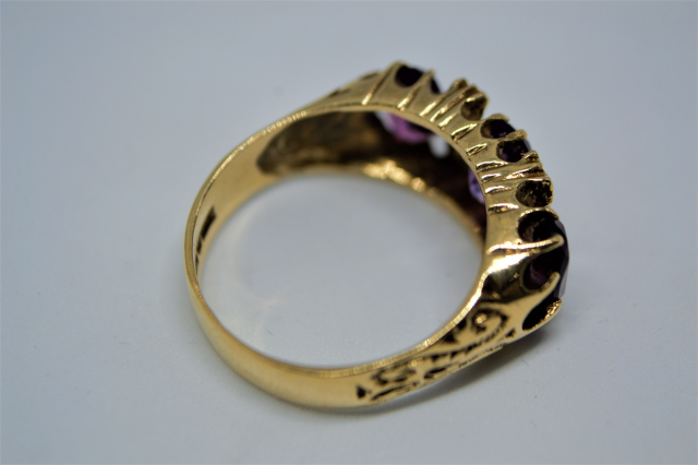 A 9ct Gold Ring with 3 Stone Amethyst.