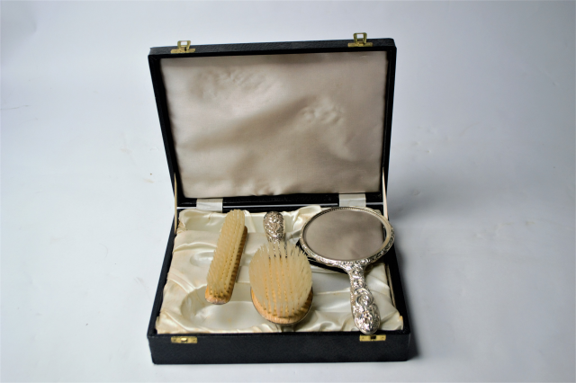 A Case of Solid Sterling Silver Dressing Table Set.