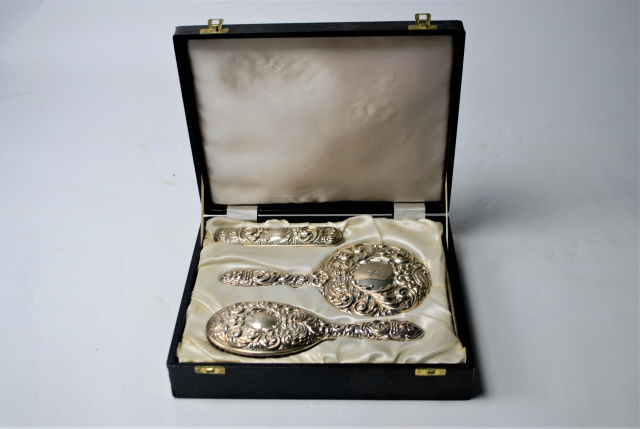 A Case of Solid Sterling Silver Dressing Table Set.