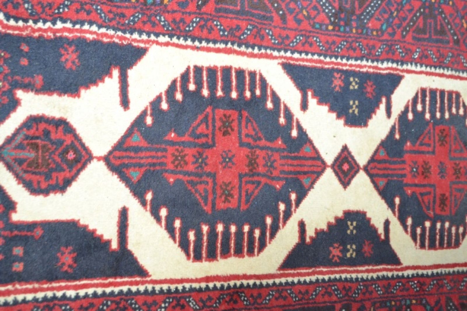 A large Afghan Carpet.